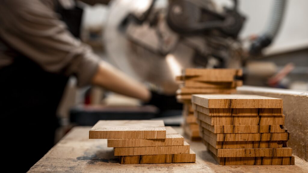 side-view-female-carpenter-studio-using-electric-saw